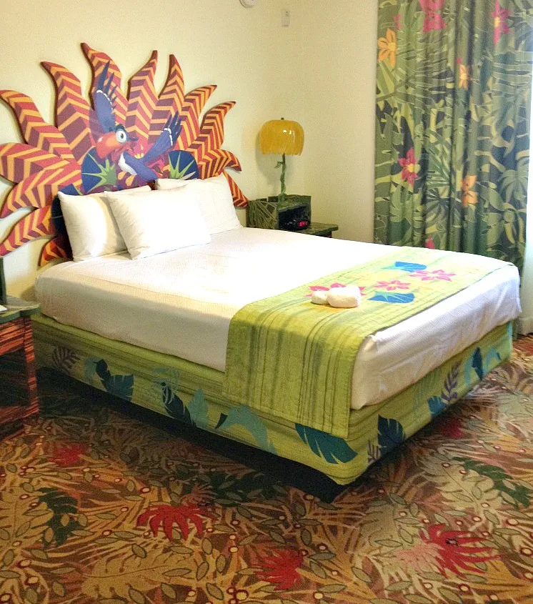Bed with Zazoo headboard in the Lion King Family Suite at Art of Animation Resort