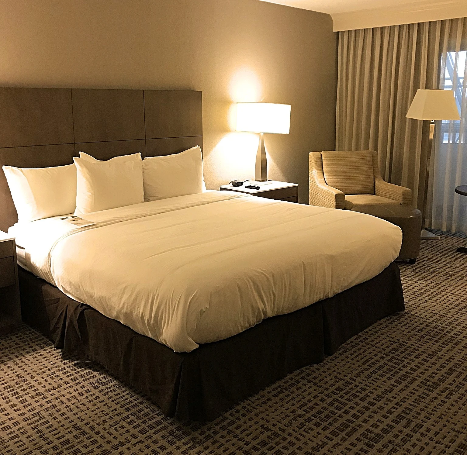 bed and sitting area in room at doubletree hotel