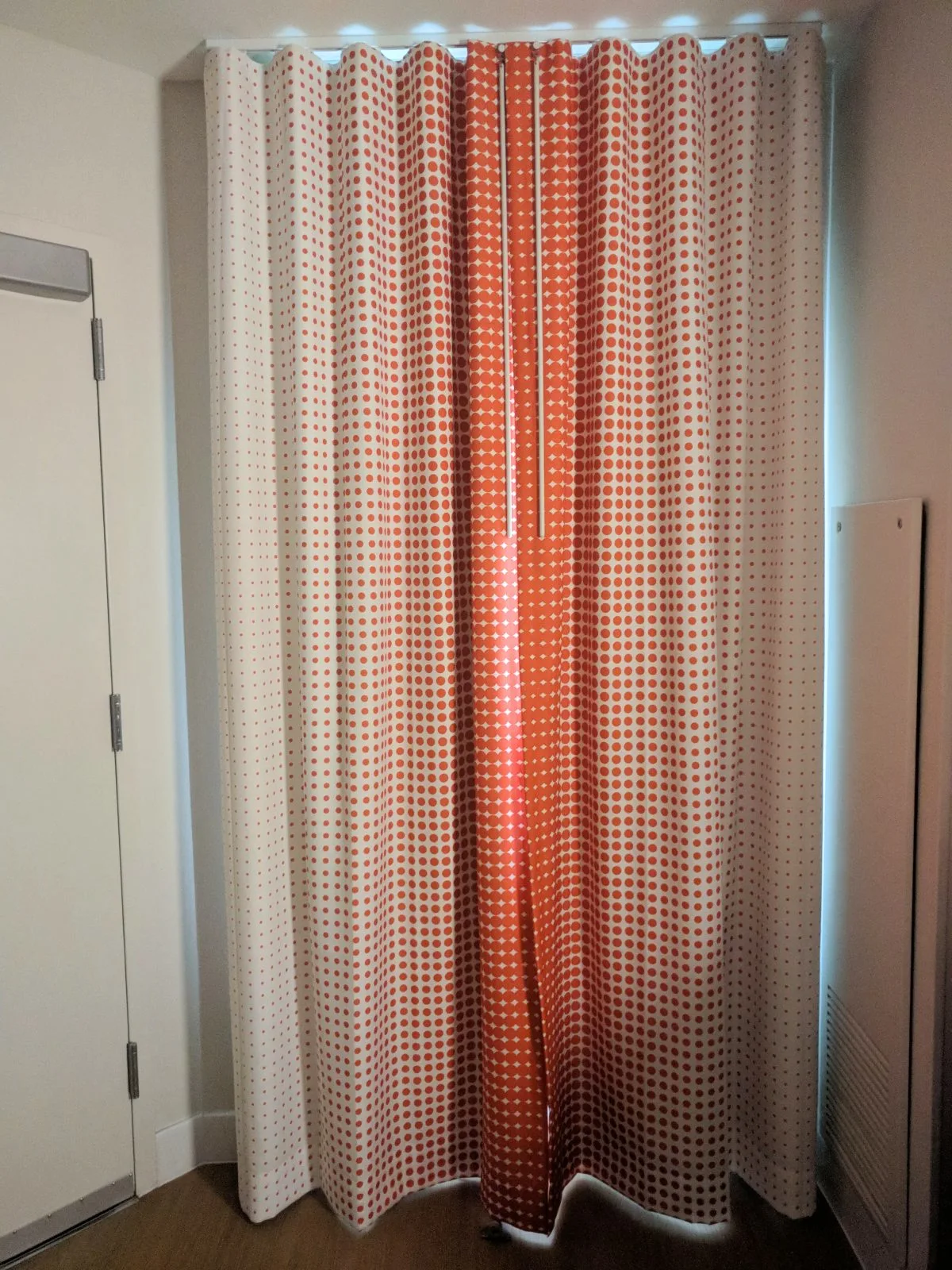 white and orange curtains in the room