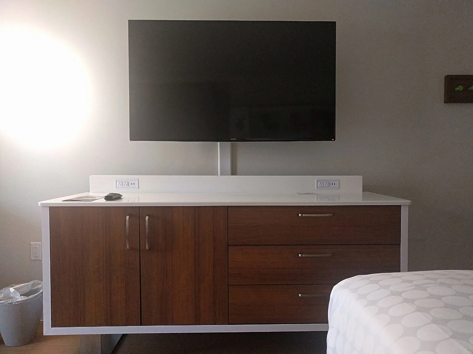 tv and dresser in the room