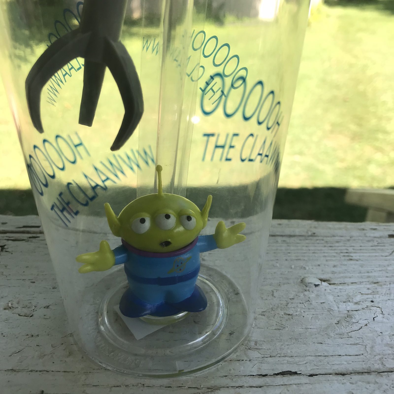 close up of the alien in the toy story alien claw cup
