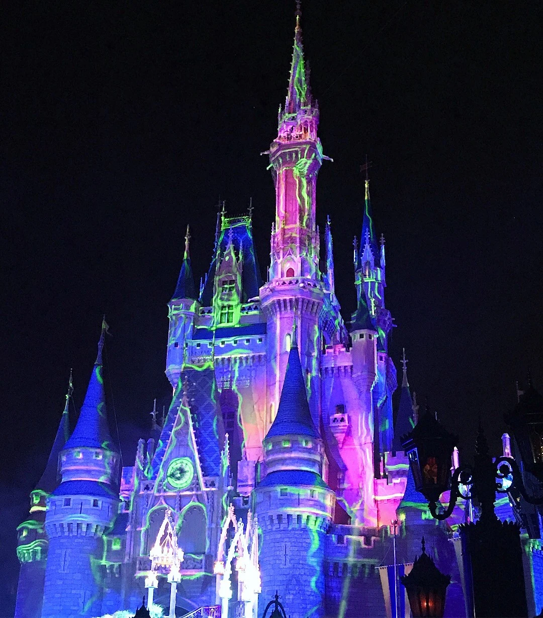 Cinderella's castle in magic kingdom lit up at night