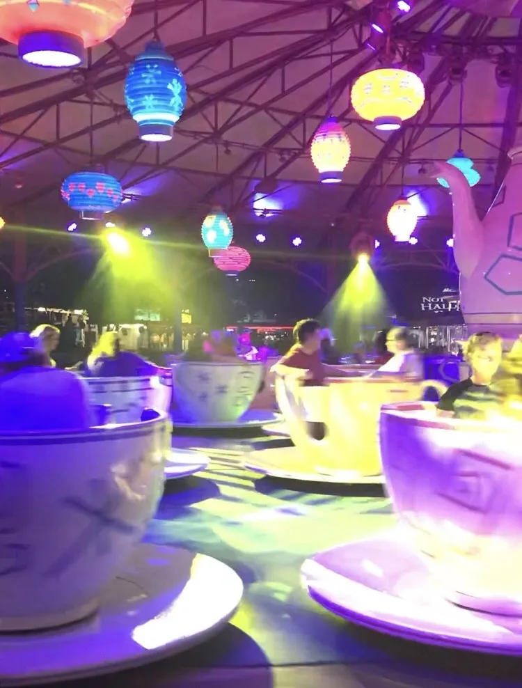 teacup ride at night with lantern lights