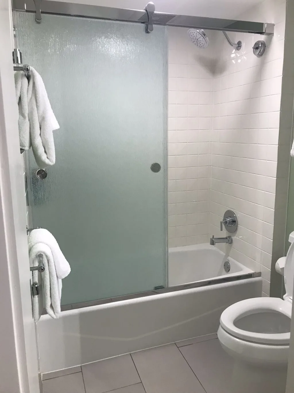 Shower tub and toilet area in an All Star Movies Resort refurbished room