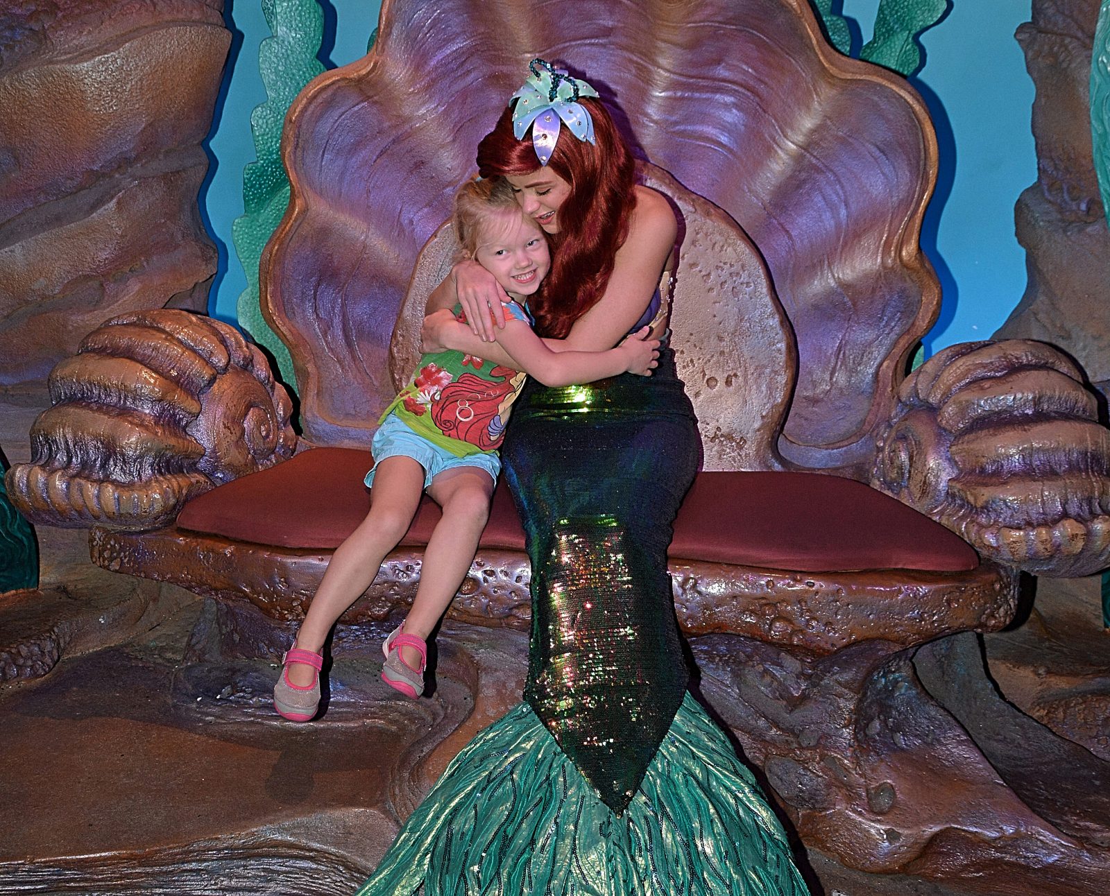 Little girl hugging Ariel at Magic Kingdom with a FastPass