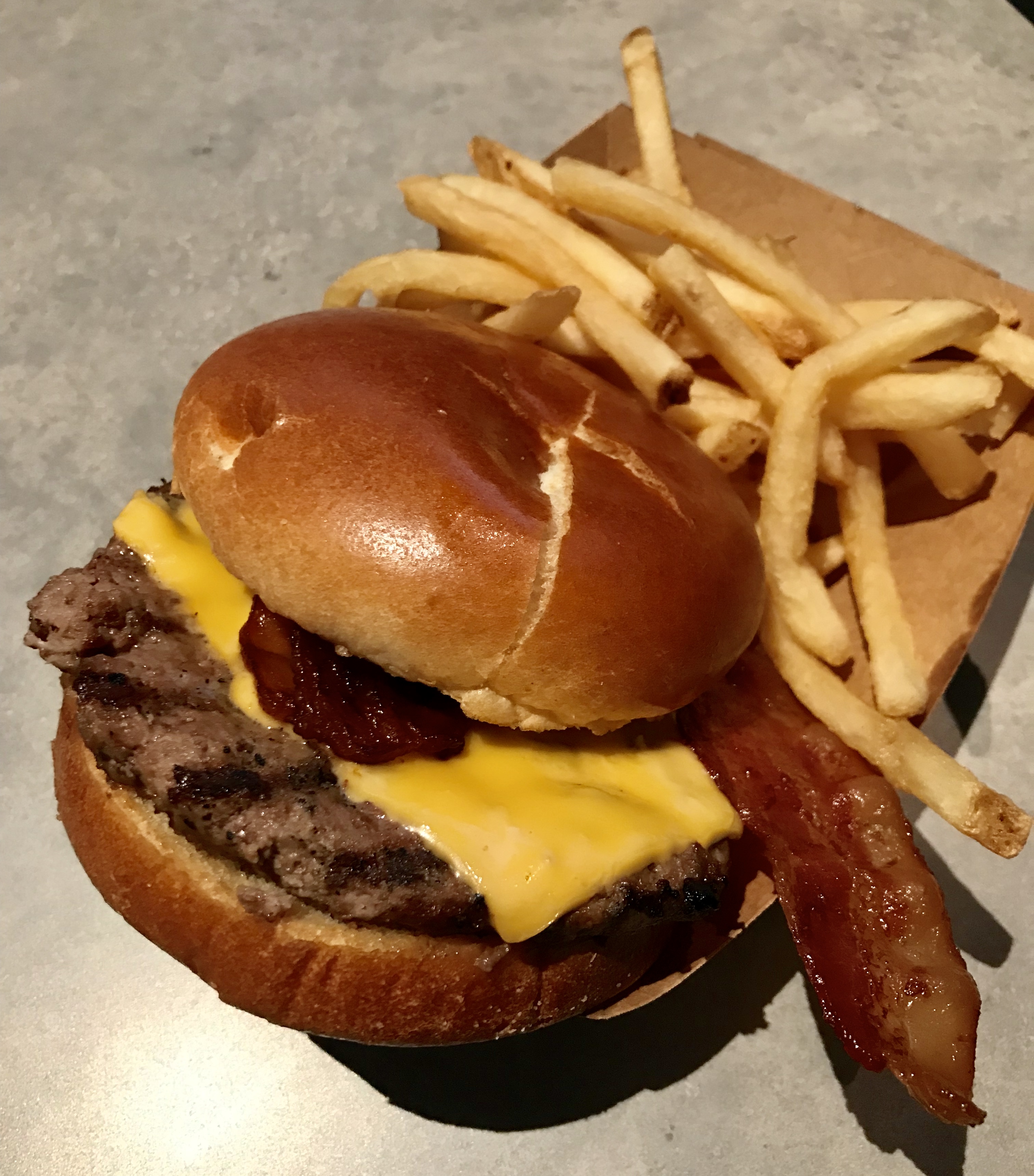 angus bacon cheeseburger and fries from backlot express restaurant