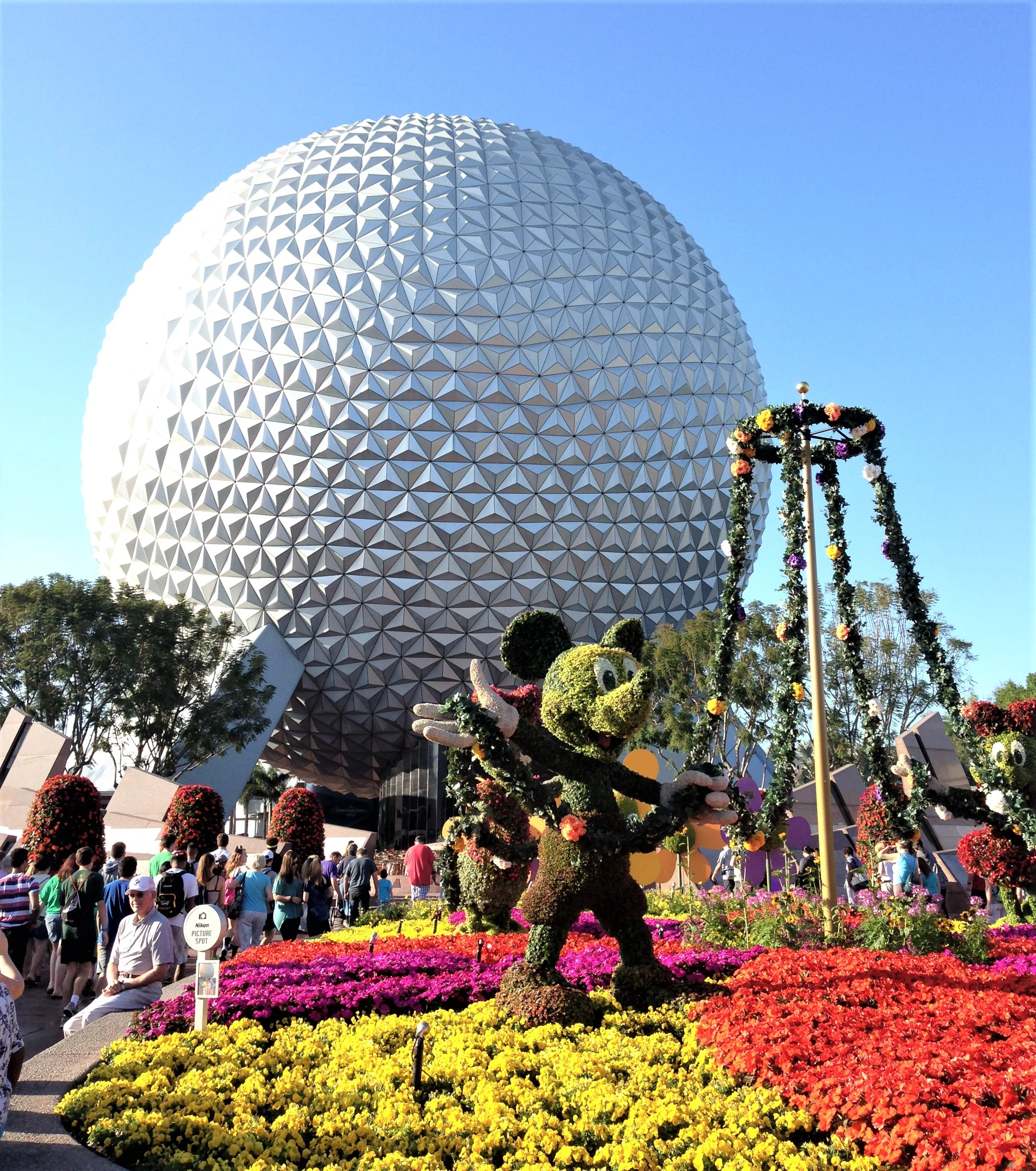 spaceship earth with flowers - disney world weather in march