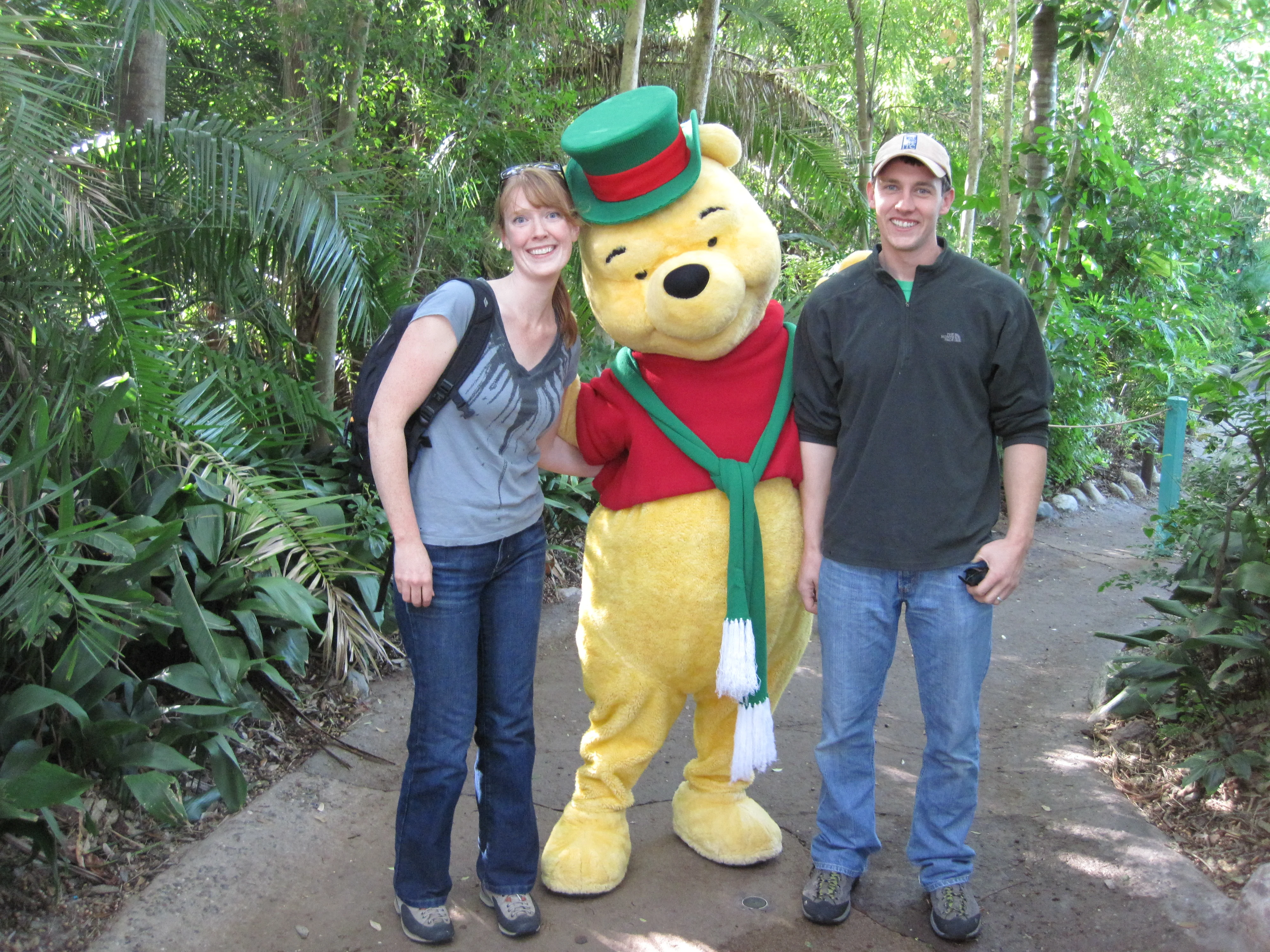 couple posing with winnie the pooh