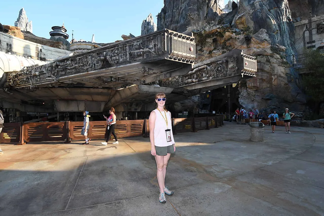 woman posing in front of galaxy's edge