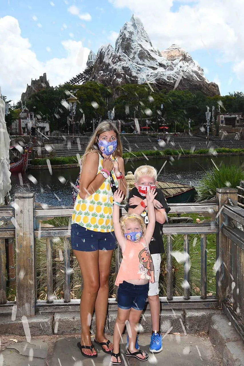 family in front of expedition everest