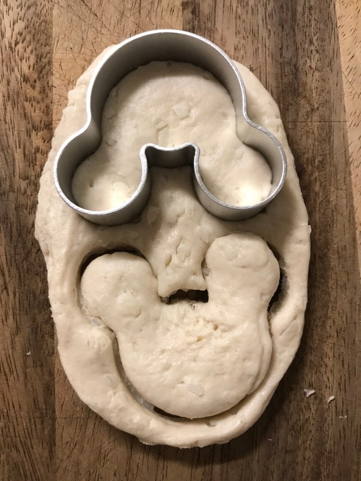 mickey cookie cutter on dough
