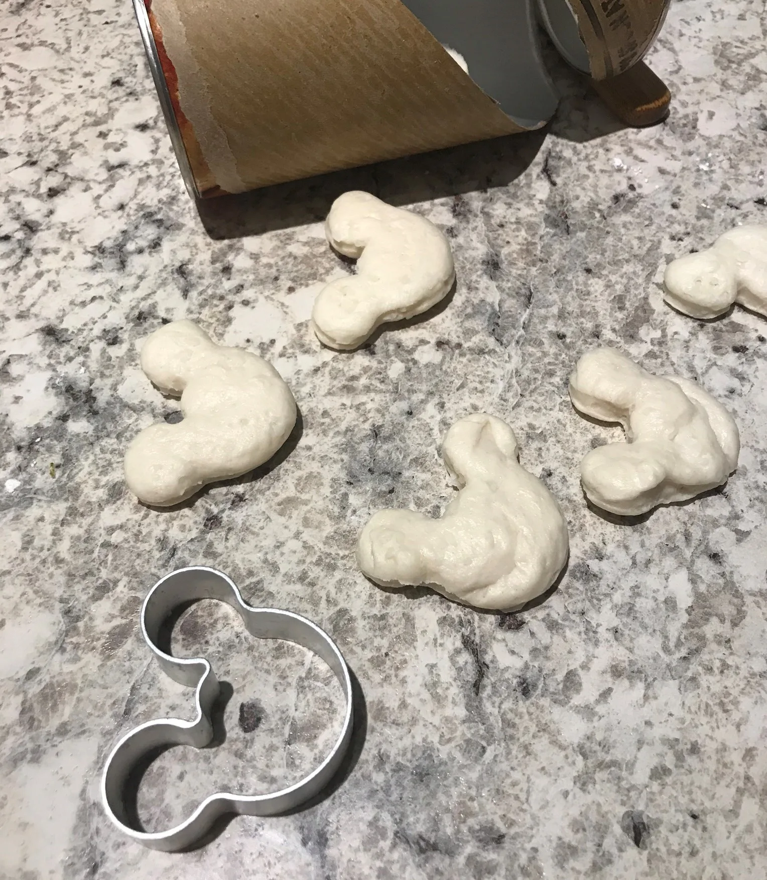 mickey shaped cutouts of biscuit dough