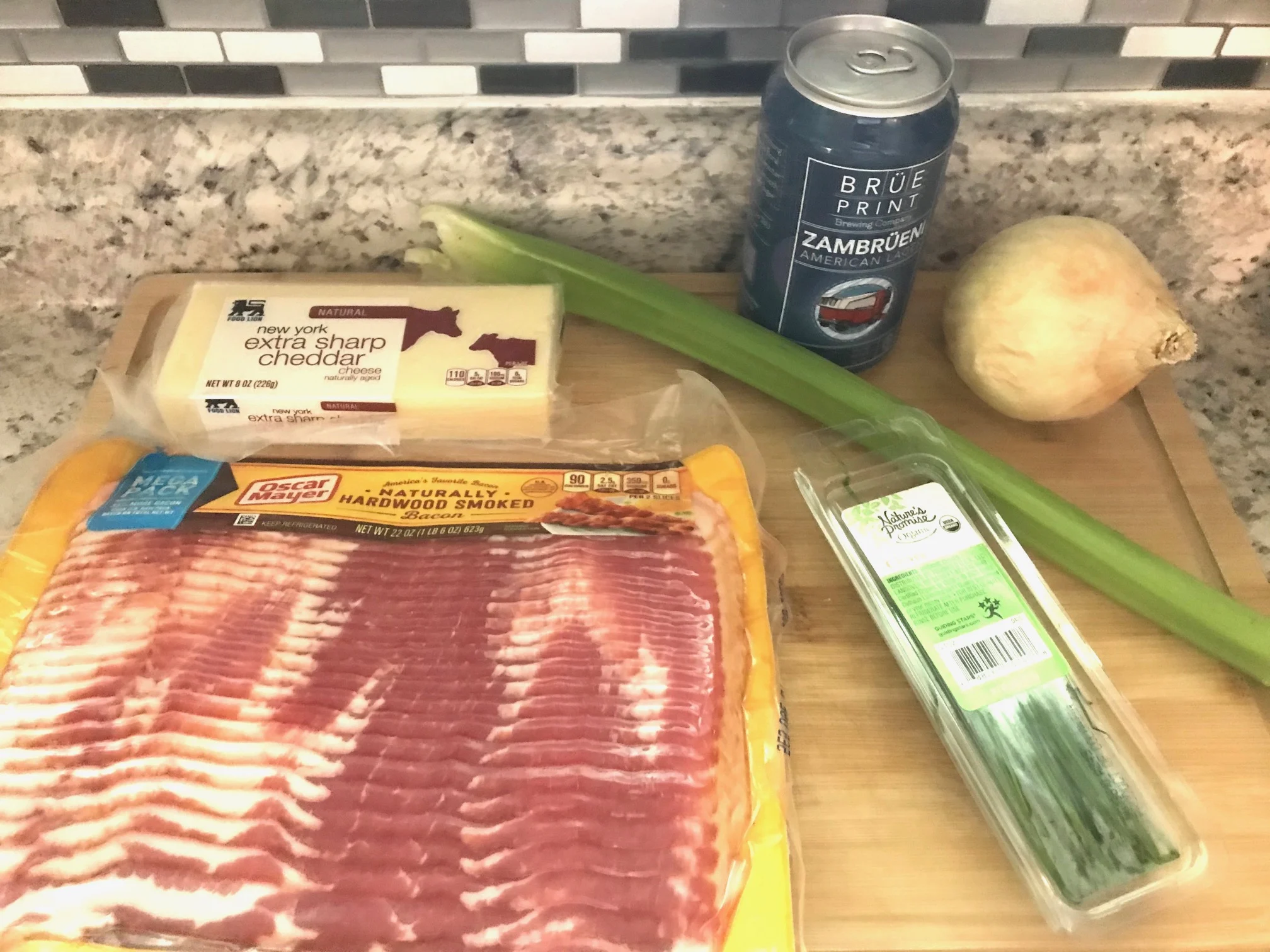 main ingredients for the soup - bacon, cheese, celery, onion, beer, and chives