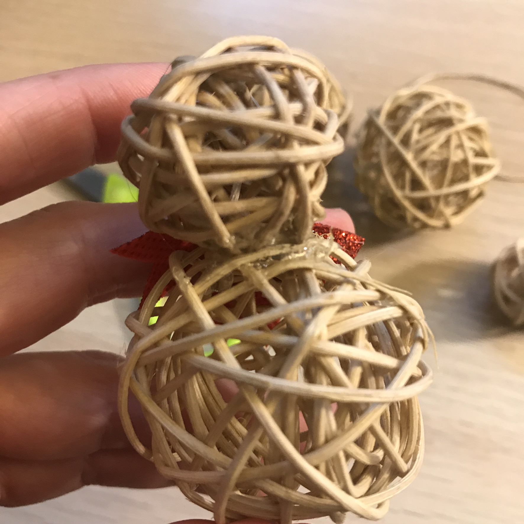attaching small willow ball to large one with hot glue